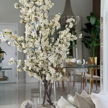 Tall White Blossom Branch Arrangement in Clear Glass Vase