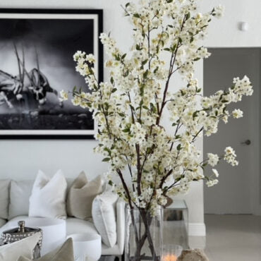 Tall White Blossom Branch Arrangement in Clear Glass Vase