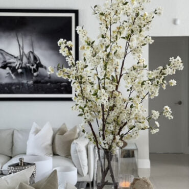 Tall White Blossom Branch Arrangement in Clear Glass Vase