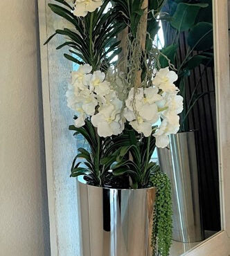 Elegant White Orchid & Tropical Foliage Arrangement in Silver Mirror Vase